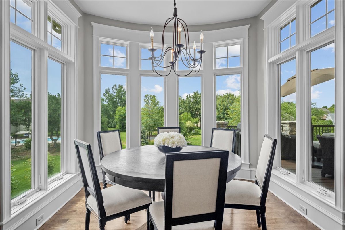 754 Wild Ginger Road Sugar Grove, IL 60554 - Photo 18 of 52 a view of a dining room with furniture wooden floor and chandelier