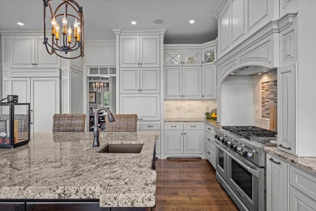 754 Wild Ginger Road Sugar Grove, IL 60554 - Photo 19 of 52 a kitchen with stainless steel appliances granite countertop a stove and a sink