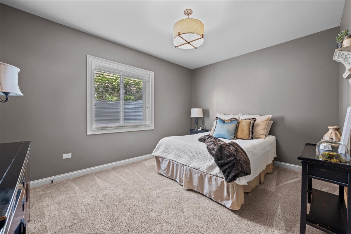 754 Wild Ginger Road Sugar Grove, IL 60554 - Photo 32 of 52 a bedroom with bed and a window