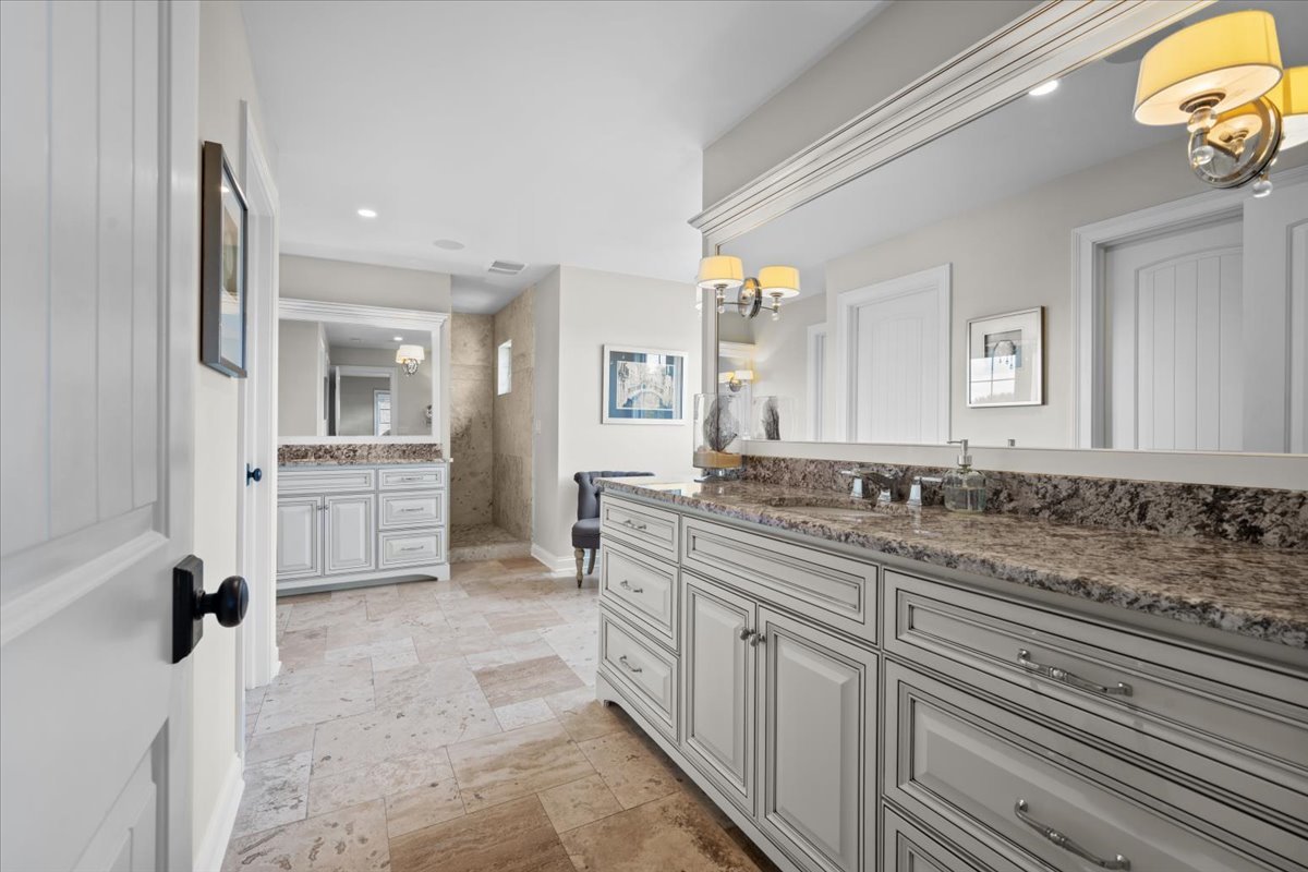 754 Wild Ginger Road Sugar Grove, IL 60554 - Photo 35 of 52 a spacious bathroom with a granite countertop sink mirror and cabinets