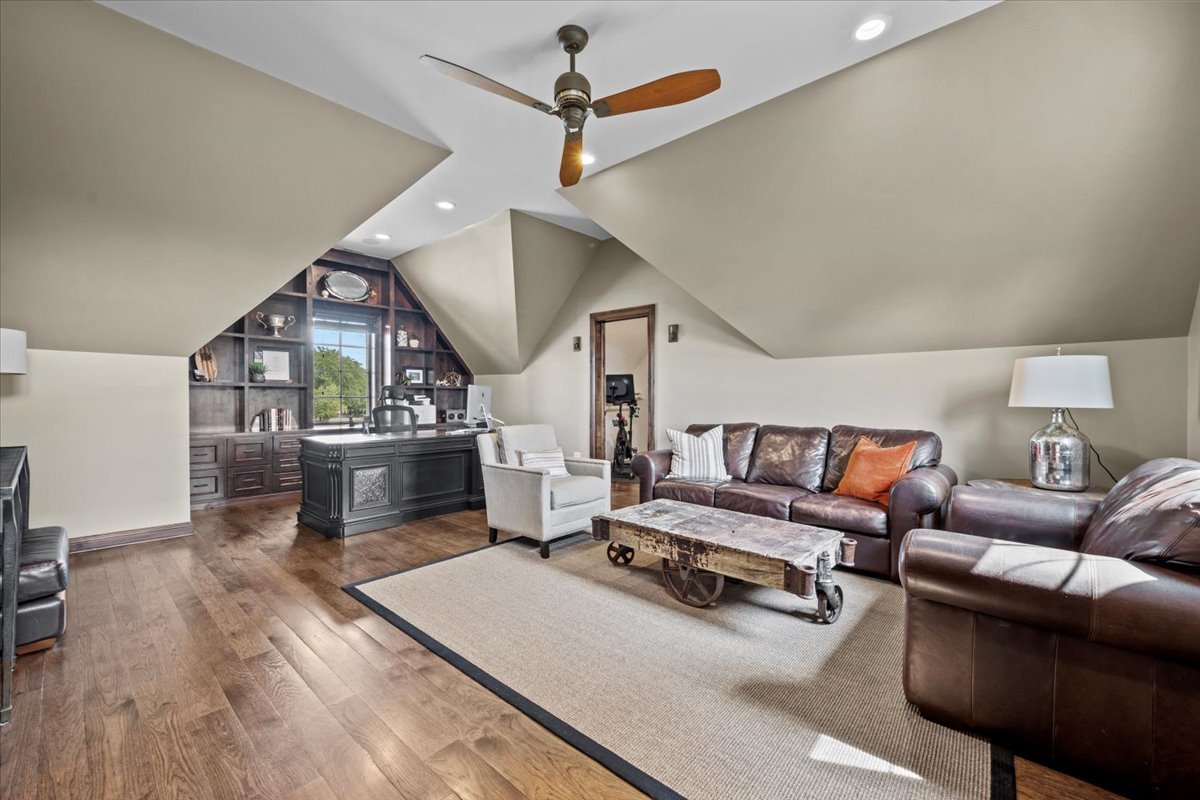754 Wild Ginger Road Sugar Grove, IL 60554 - Photo 41 of 52 a living room with furniture a fireplace and wooden floor