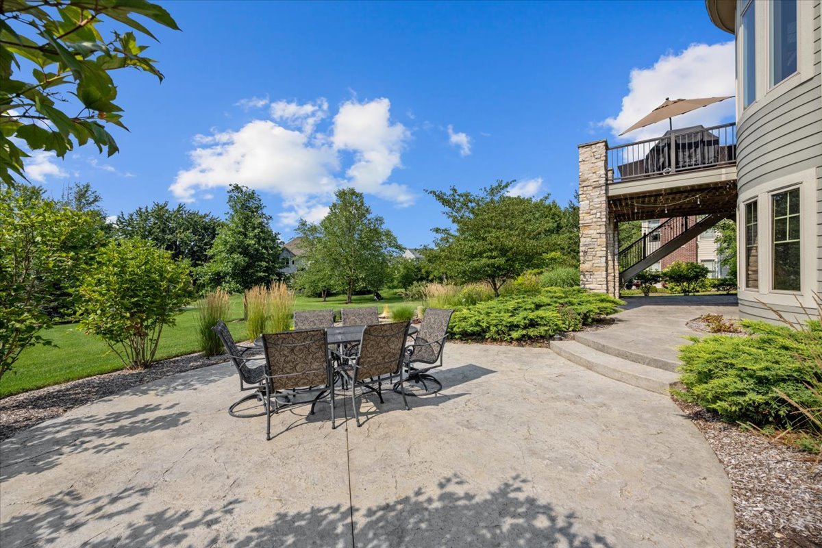 754 Wild Ginger Road Sugar Grove, IL 60554 - Photo 45 of 52 a view of a patio with table and chairs and potted plants