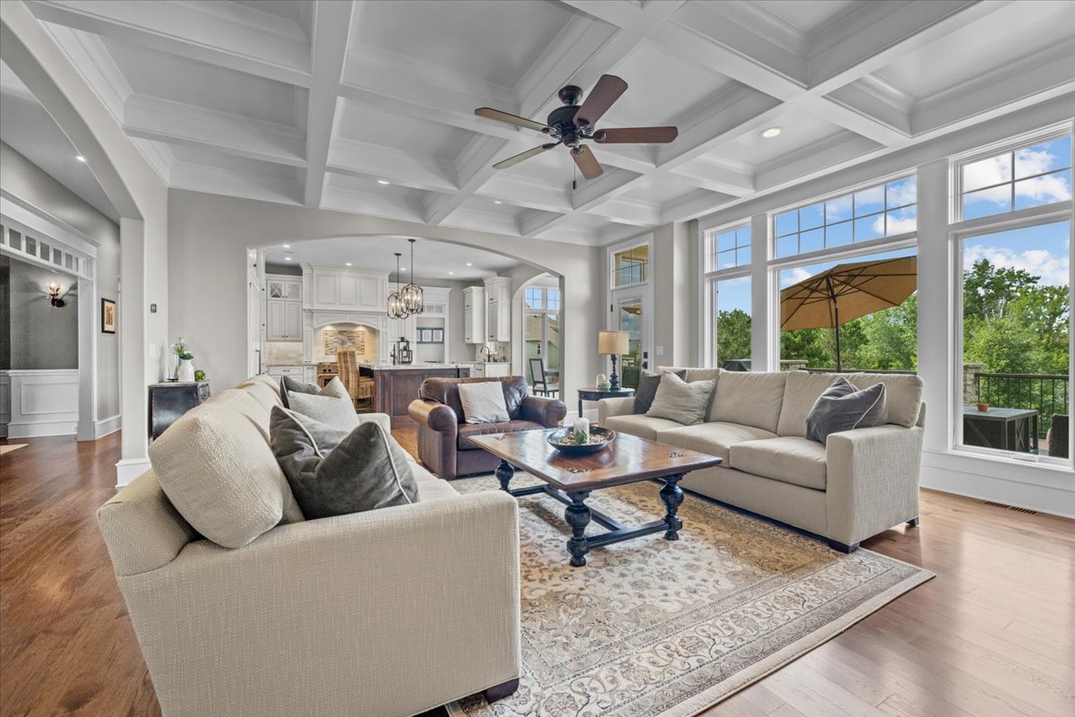 754 Wild Ginger Road Sugar Grove, IL 60554 - Photo 10 of 52 a living room with furniture and a large window with wooden floor