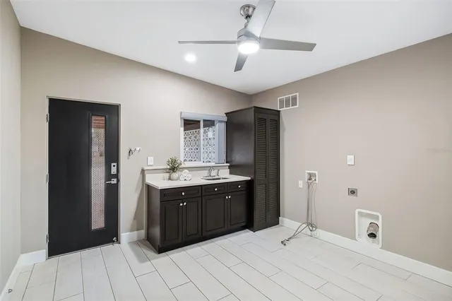 a spacious bathroom with a sink mirror and shower