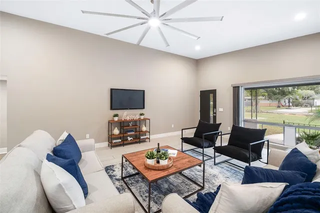 a living room with furniture and a flat screen tv