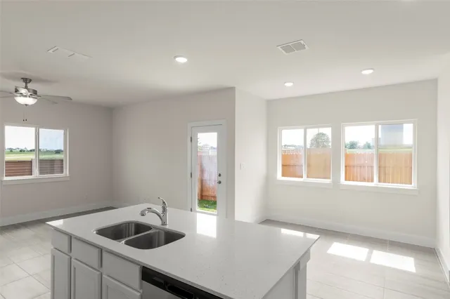 a kitchen with a stove and a refrigerator