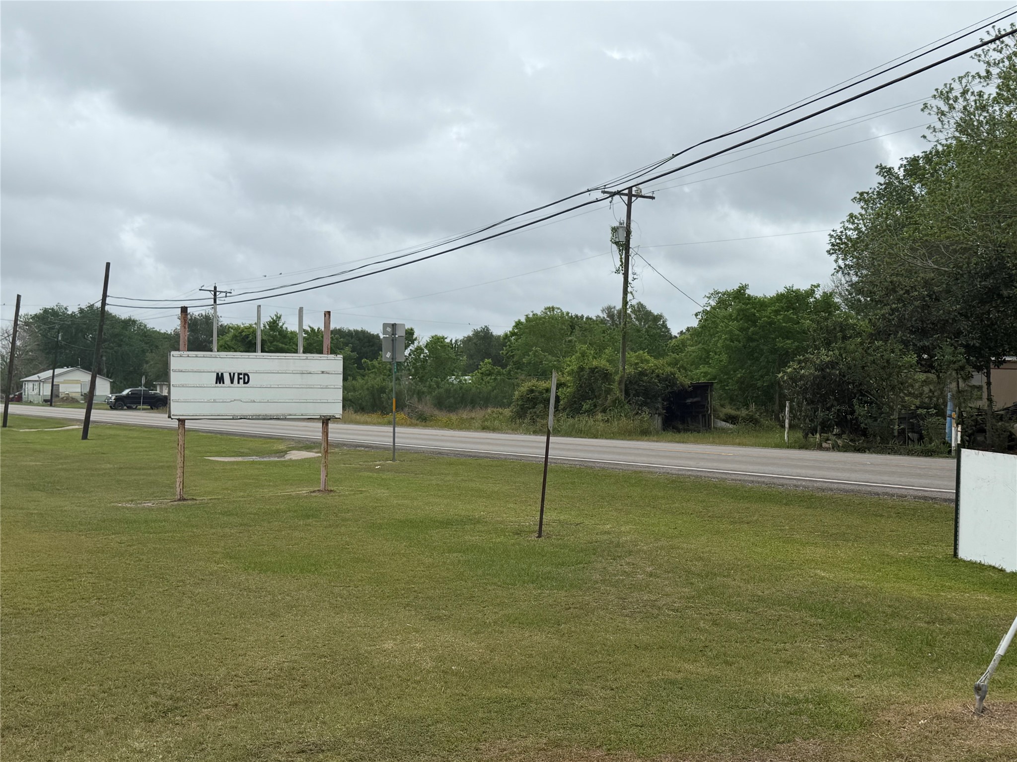 Lot 11-14 3rd Street Midfield, TX 77458 - Photo 5 of 8 a view of a field with a tree
