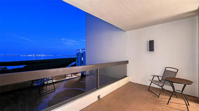 a spacious bedroom with a bed a dresser and a book shelf