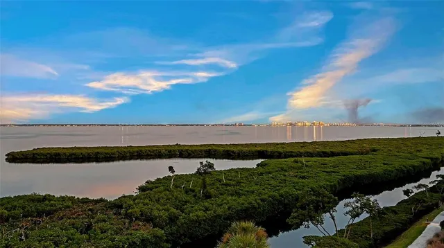 a bedroom with two beds and a window
