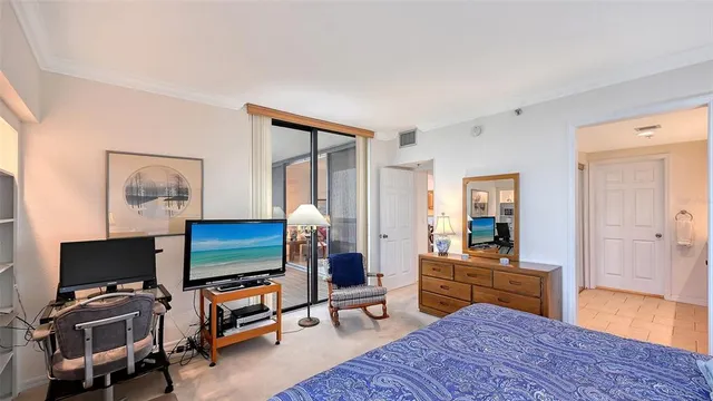 a view of a living room with a flat screen tv and a fireplace
