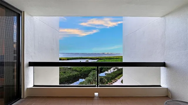 a view of a balcony with chairs