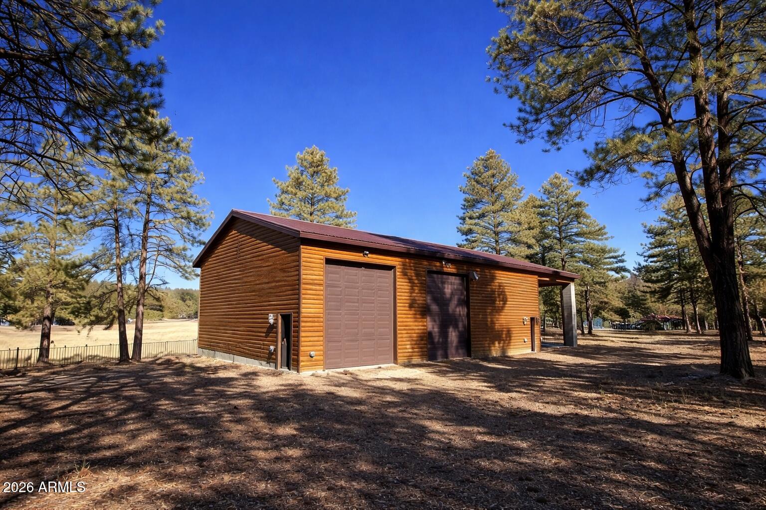 3 County Road Alpine, AZ 85920 - Photo 4 of 39 Wooden garage in forest setting