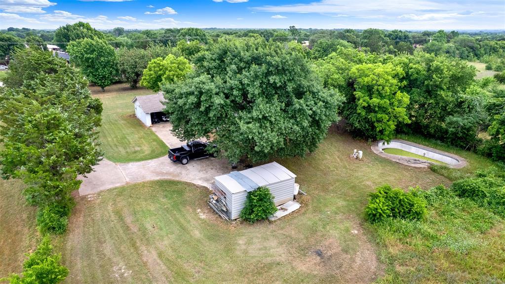 1415 South Joe Wilson Road Cedar Hill, TX 75104 - Photo 7 of 17 an aerial view of a house with a yard