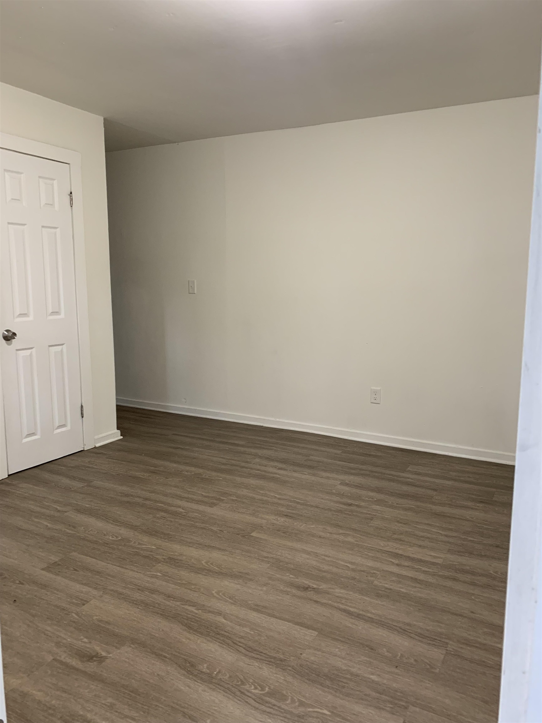 560 Christopher Street, Unit A St. Augustine, FL 32084 - Photo 5 of 8 a view of an empty room and wooden floor