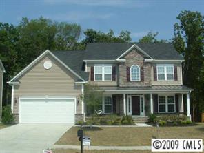 261 Lorraine Road Fort Mill, SC 29708 - Photo 1 of 8 a front view of a house with a yard
