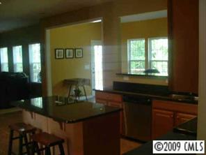 261 Lorraine Road Fort Mill, SC 29708 - Photo 3 of 8 a kitchen with a sink and cabinets