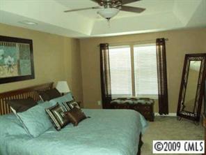 261 Lorraine Road Fort Mill, SC 29708 - Photo 4 of 8 a bed sitting in a bedroom next to a window
