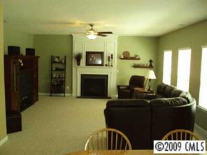 261 Lorraine Road Fort Mill, SC 29708 - Photo 7 of 8 a living room with furniture and a fireplace