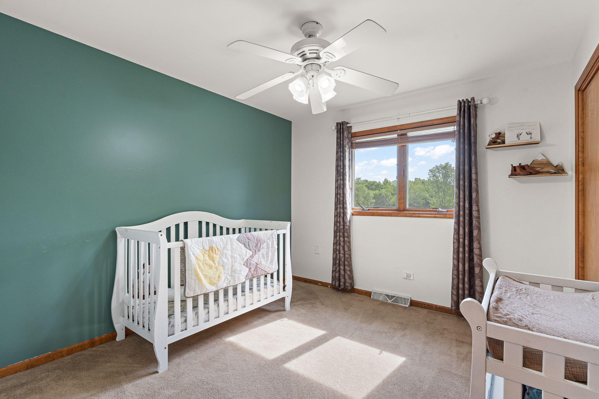 8987 Calhoun Place Crown Point, IN 46307 - Photo 13 of 28 a bedroom with a bed and a chandelier