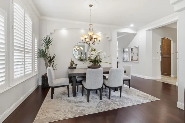 a dining room with furniture and window