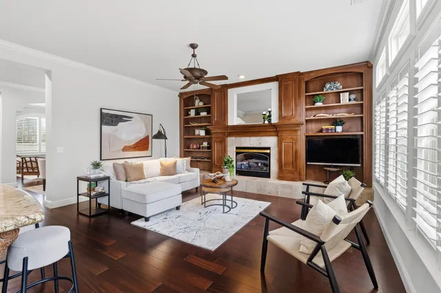 a living room with furniture fireplace and a flat screen tv