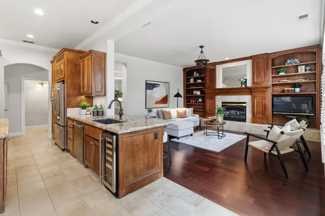 a kitchen with stainless steel appliances granite countertop a stove and a refrigerator