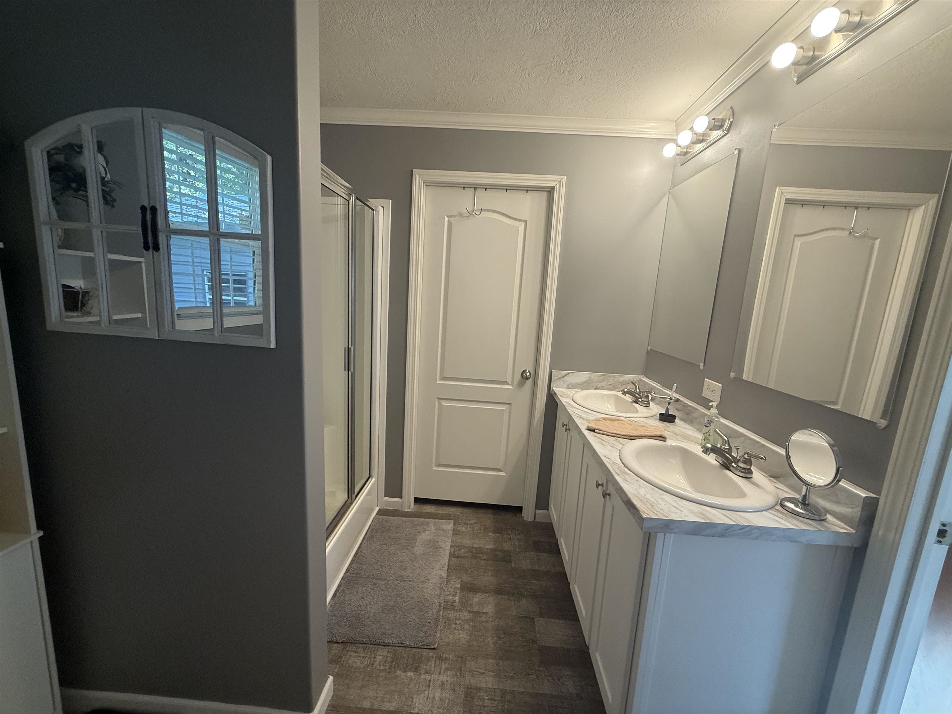 185 Pine Tree Road Moscow, TN 38057 - Photo 20 of 36 Dual vanity with undermount sinks, chrome fixtures, and a light-colored countertop