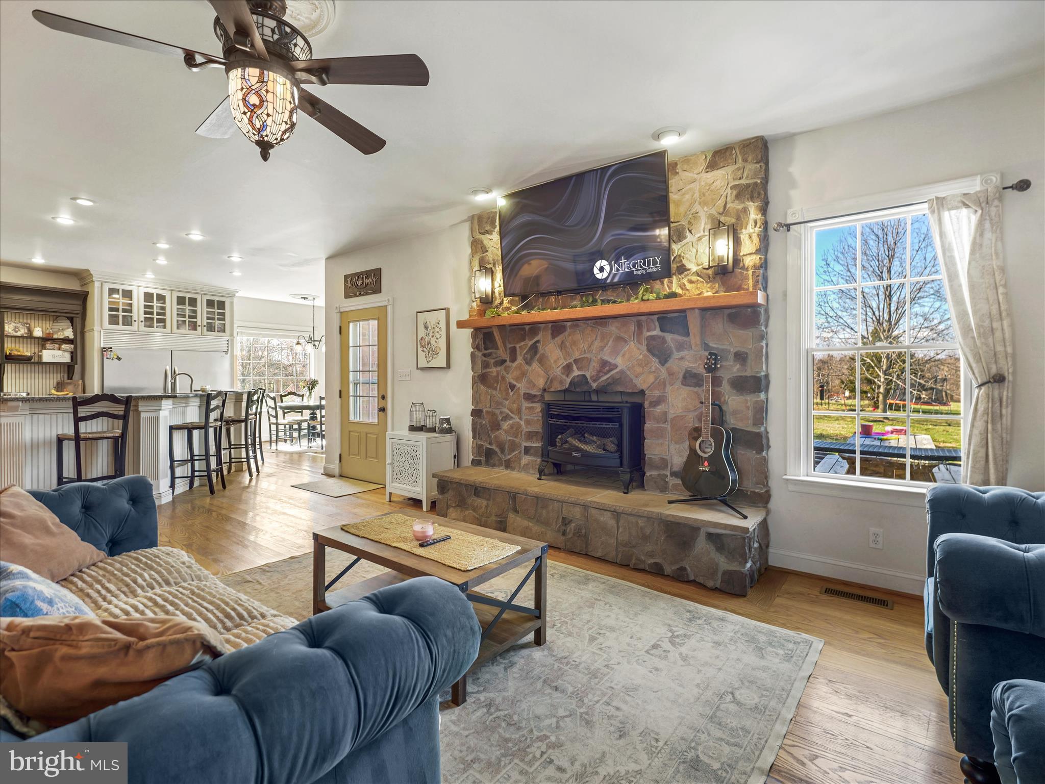 126 Heritage Knoll Ln Summit Point Summit Point, WV 25446 - Photo 27 of 64 a living room with furniture and a fireplace