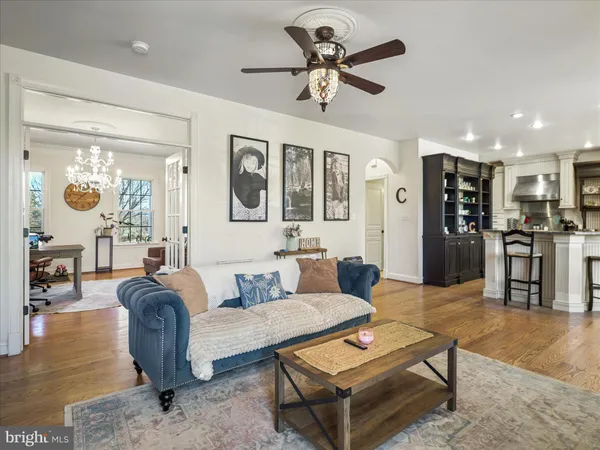 a bedroom with a bed and ceiling fan