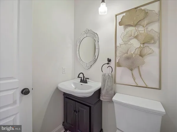 a bathroom with a sink a vanity and a mirror