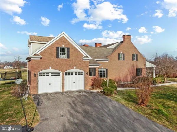 a view of a patio with table and chairs potted plants with lake view