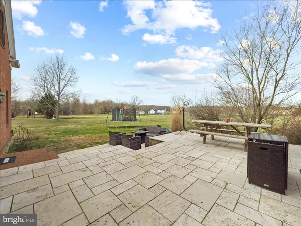a view of a house with a yard and garage