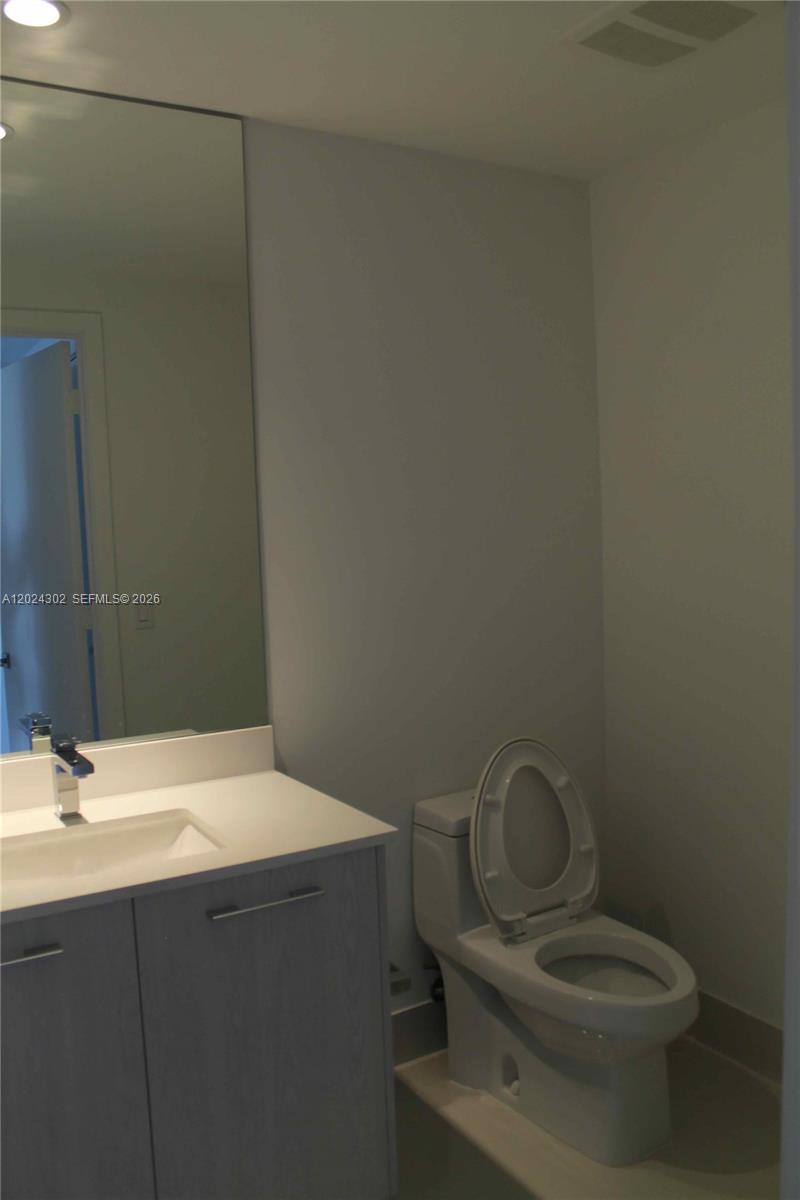 45 Southwest 9th Street, Unit 2109 Miami, FL 33130 - Photo 11 of 40 a bathroom with a sink and a toilet