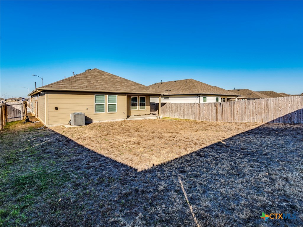 316 Addison Place Lockhart, TX 78644 - Photo 27 of 28 a front view of a house with a yard