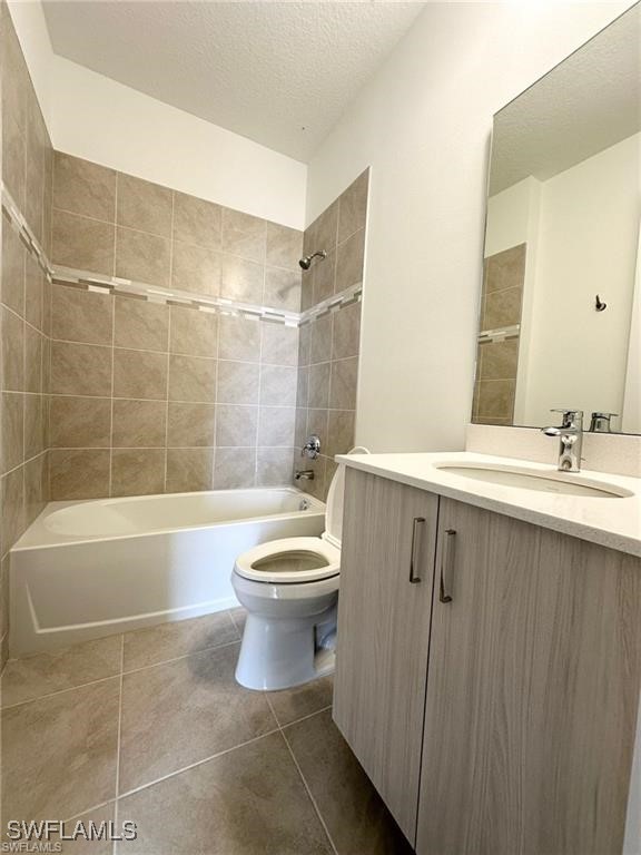 5221 Marano Drive Immokalee, FL 34142 - Photo 15 of 40 a bathroom with a toilet a sink and bathtub