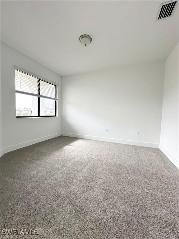 5221 Marano Drive Immokalee, FL 34142 - Photo 18 of 40 an empty room with a windows and closet