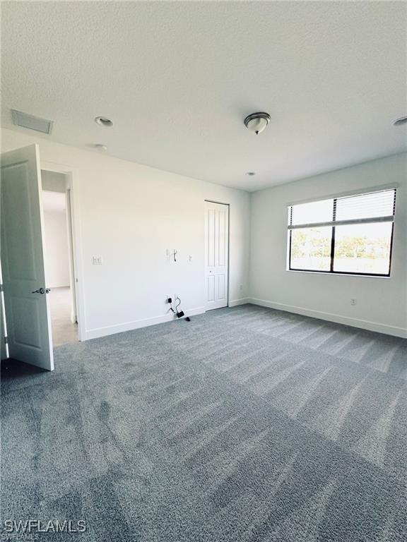 5221 Marano Drive Immokalee, FL 34142 - Photo 20 of 40 a view of an empty room with window and wooden floor
