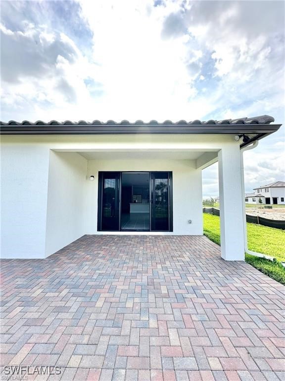 5221 Marano Drive Immokalee, FL 34142 - Photo 23 of 40 a view of a house with a yard and a pond
