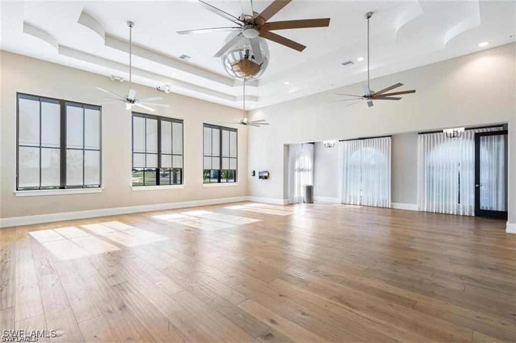 5221 Marano Drive Immokalee, FL 34142 - Photo 38 of 40 a view of an empty room with a window and wooden floor