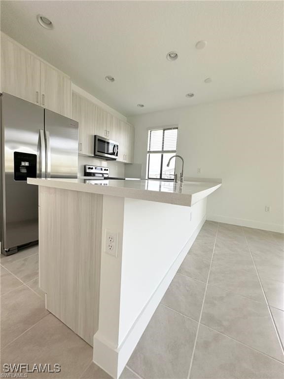 5221 Marano Drive Immokalee, FL 34142 - Photo 4 of 40 a kitchen with stainless steel appliances a refrigerator and a stove top oven