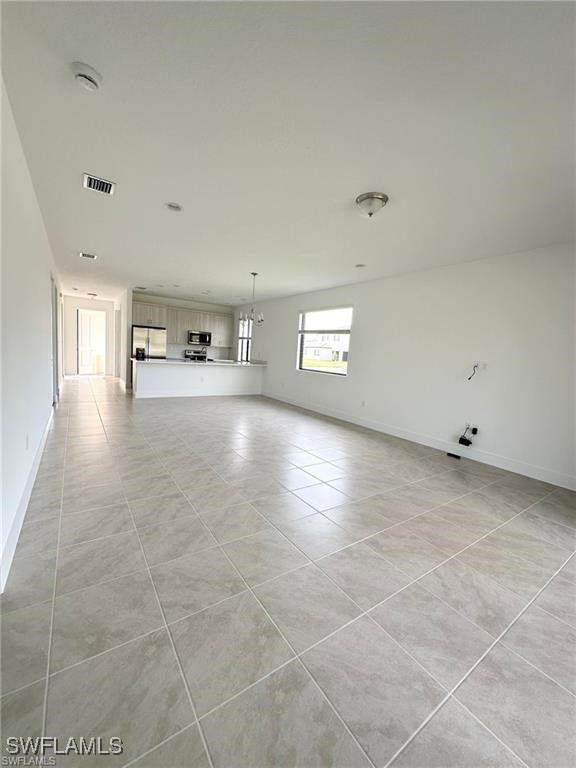5221 Marano Drive Immokalee, FL 34142 - Photo 8 of 40 a view of a livingroom with an empty space and window