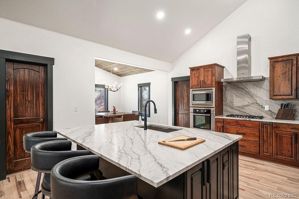 16654 South 7th Street Pine, CO 80470 - Photo 18 of 50 a kitchen with a table and chairs