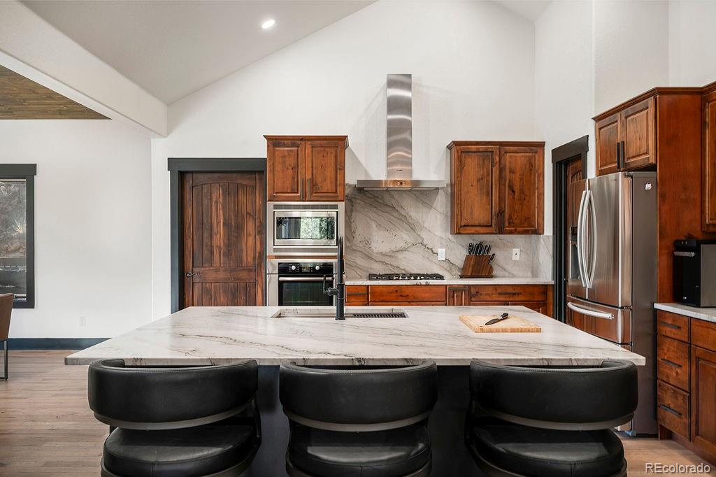 16654 South 7th Street Pine, CO 80470 - Photo 19 of 50 a room with granite countertop a sink and a stove