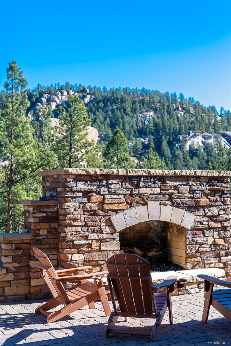 16654 South 7th Street Pine, CO 80470 - Photo 39 of 50 a terrace with outdoor seating and trees