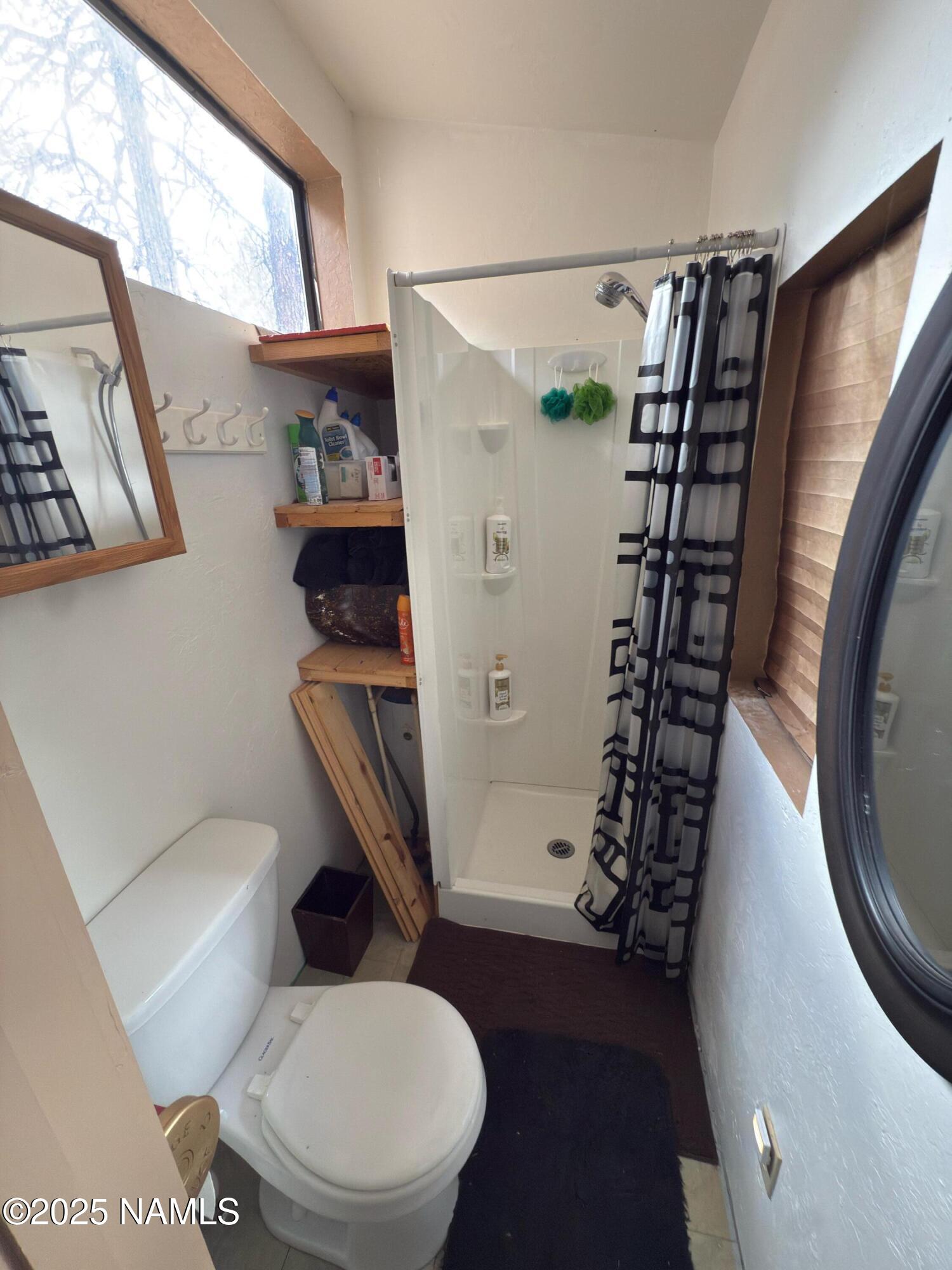 7261 East Long Bow Drive Williams, AZ 86046 - Photo 26 of 43 a bathroom with a toilet and a shower