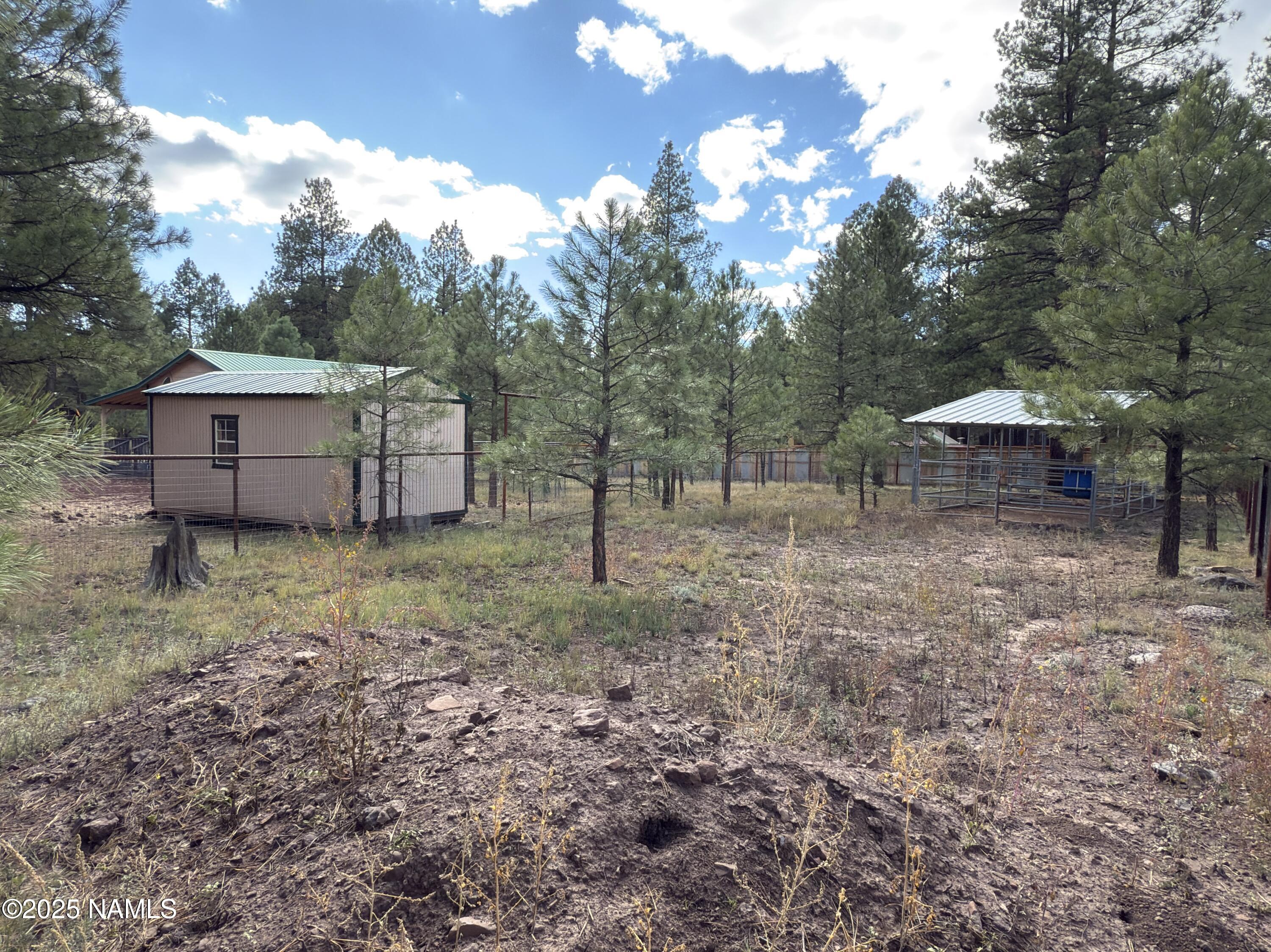 7261 East Long Bow Drive Williams, AZ 86046 - Photo 3 of 43 a view of a house with a backyard