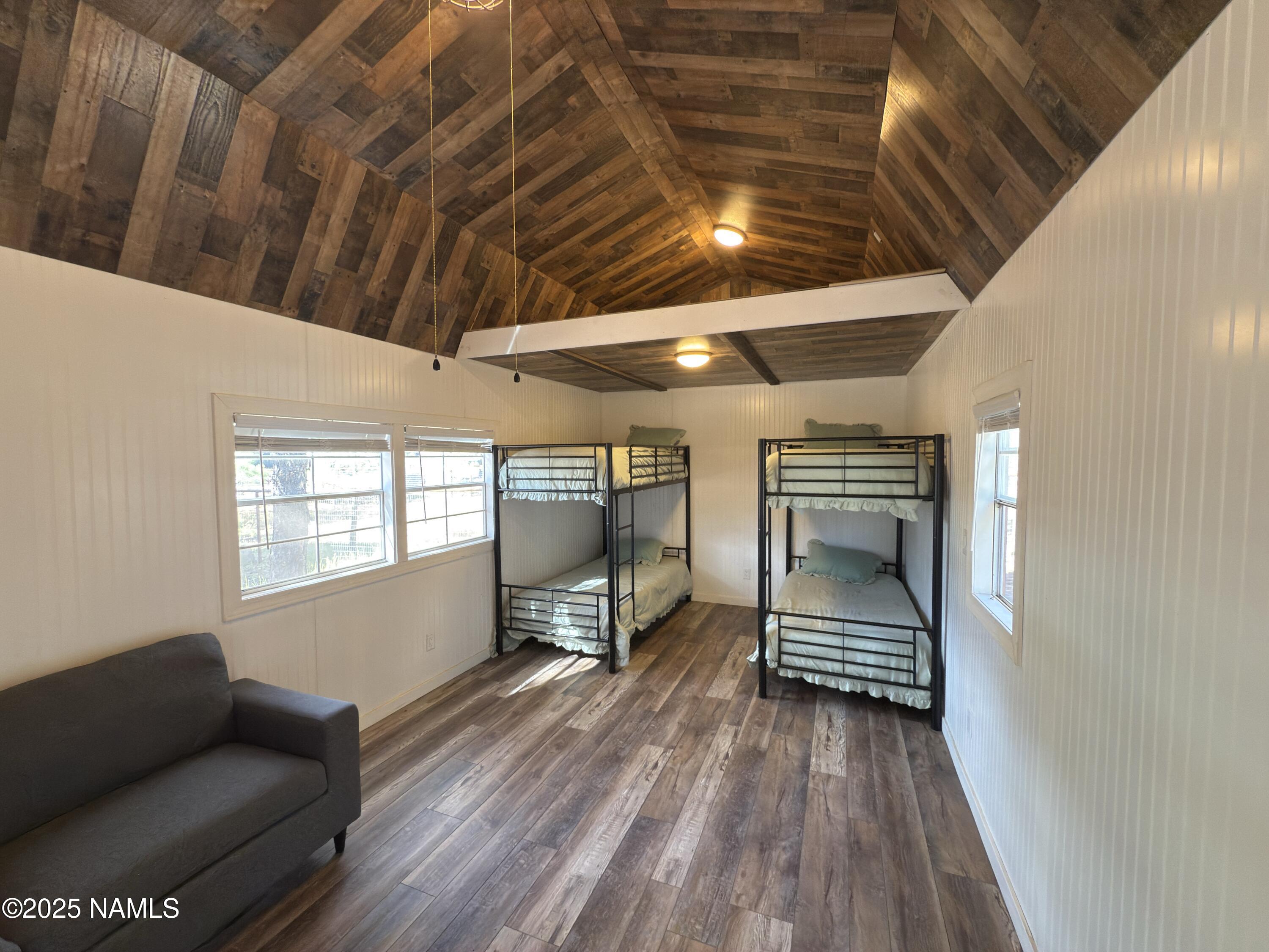 7261 East Long Bow Drive Williams, AZ 86046 - Photo 32 of 43 a view of empty room with wooden floor