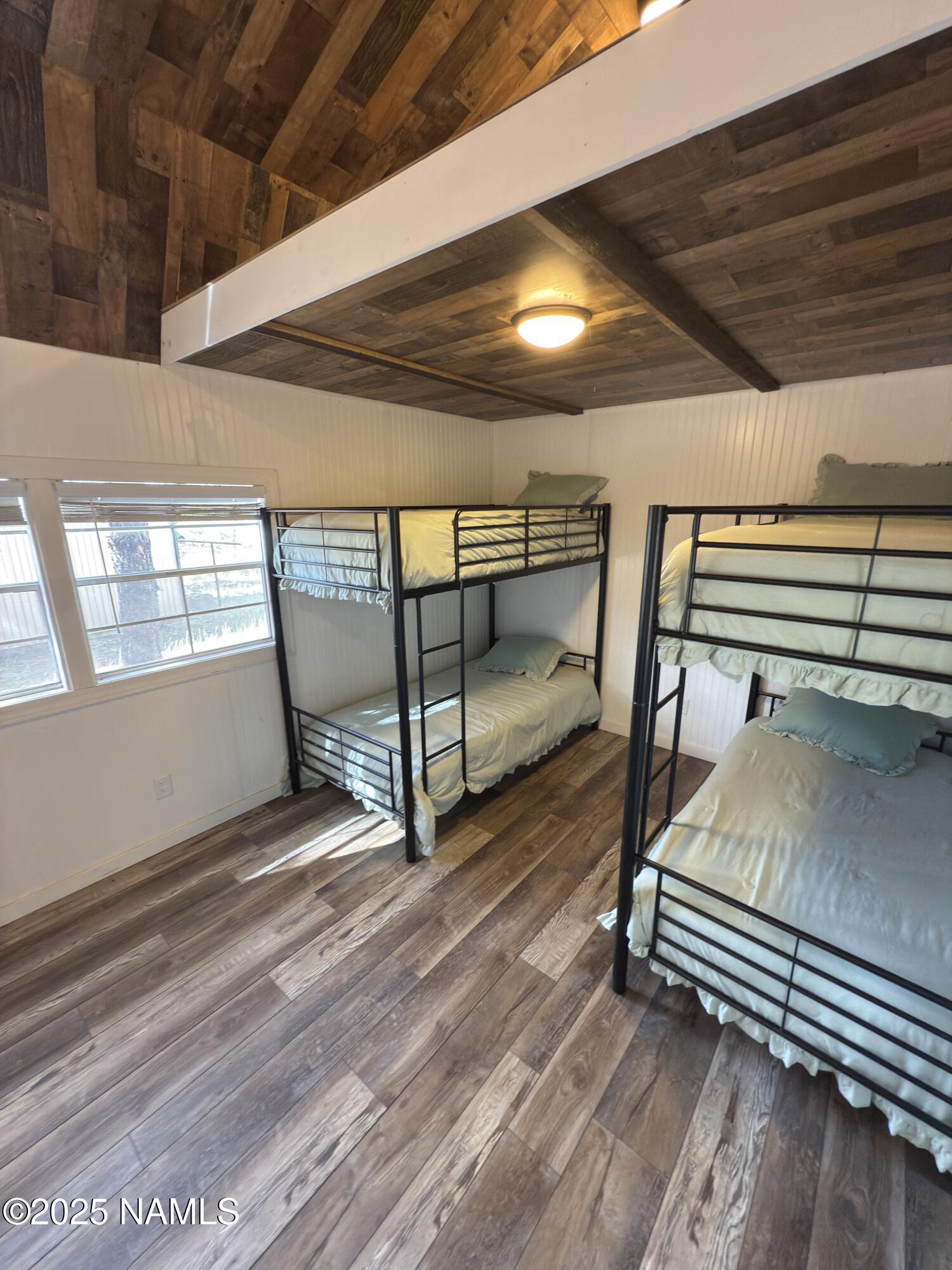 7261 East Long Bow Drive Williams, AZ 86046 - Photo 33 of 43 a bedroom with double bunk beds and a window