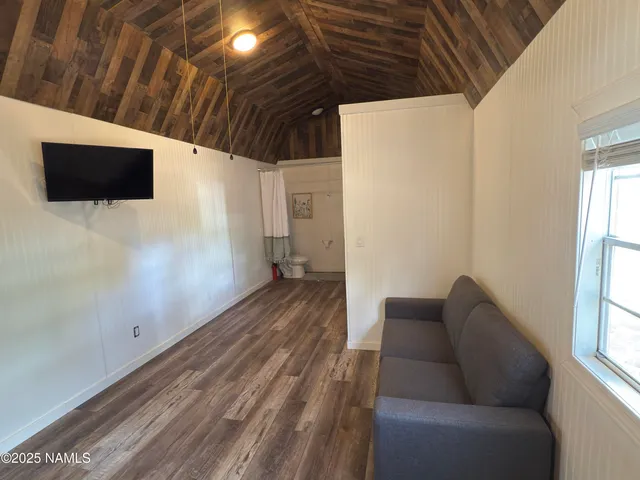 a hallway with furniture and a window