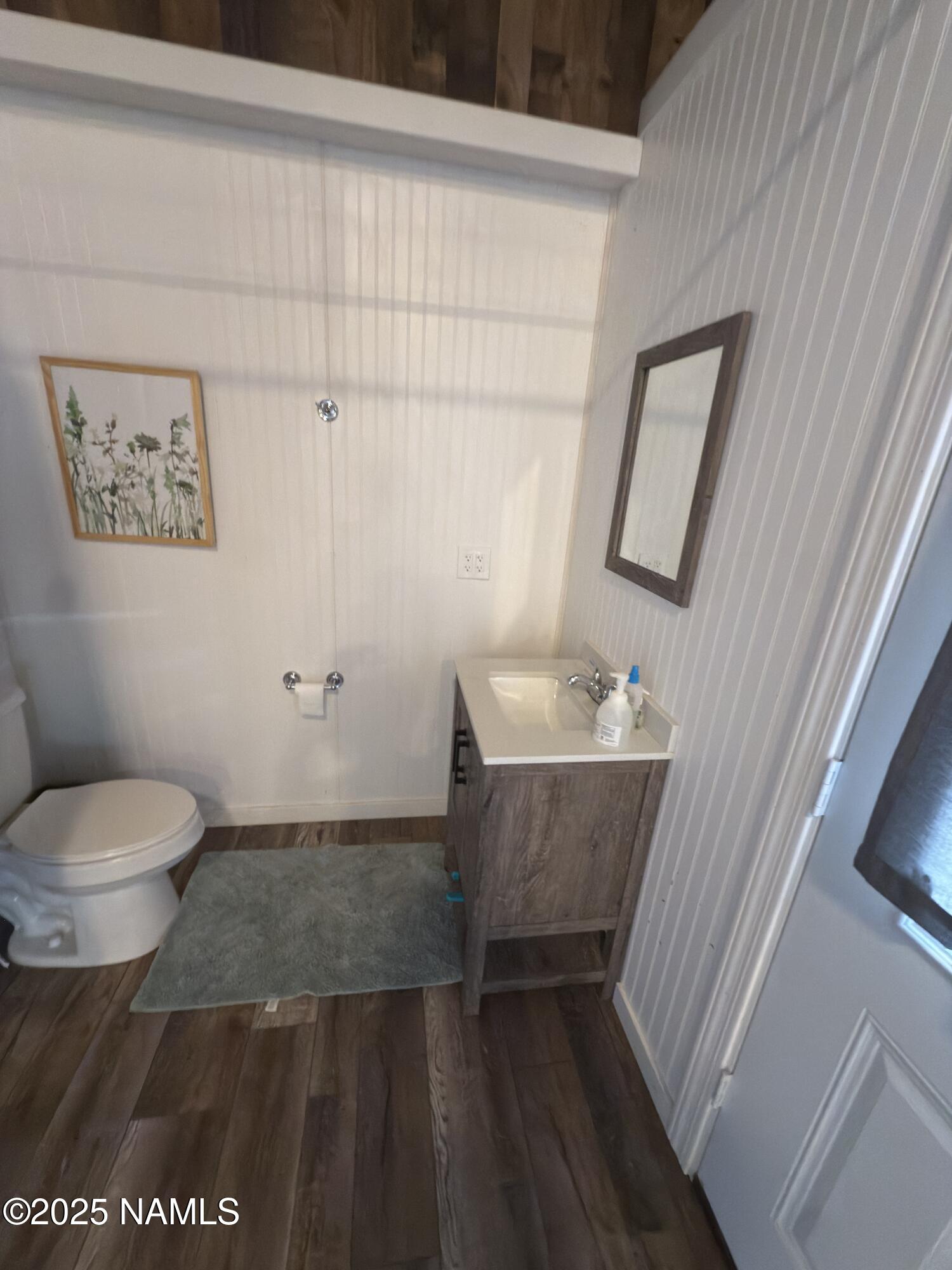 7261 East Long Bow Drive Williams, AZ 86046 - Photo 39 of 43 a bathroom with a toilet a sink and mirror